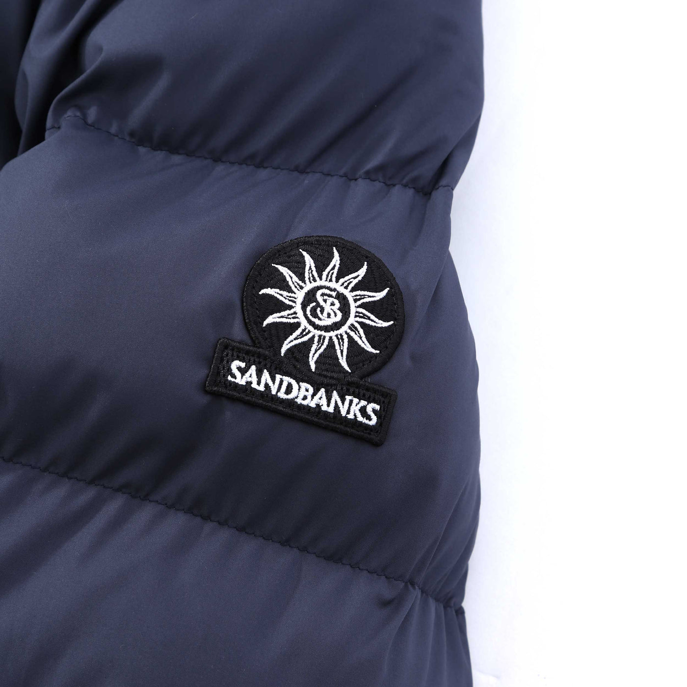 Sandbanks Ravine Mid Puffer Jacket in Navy Logo